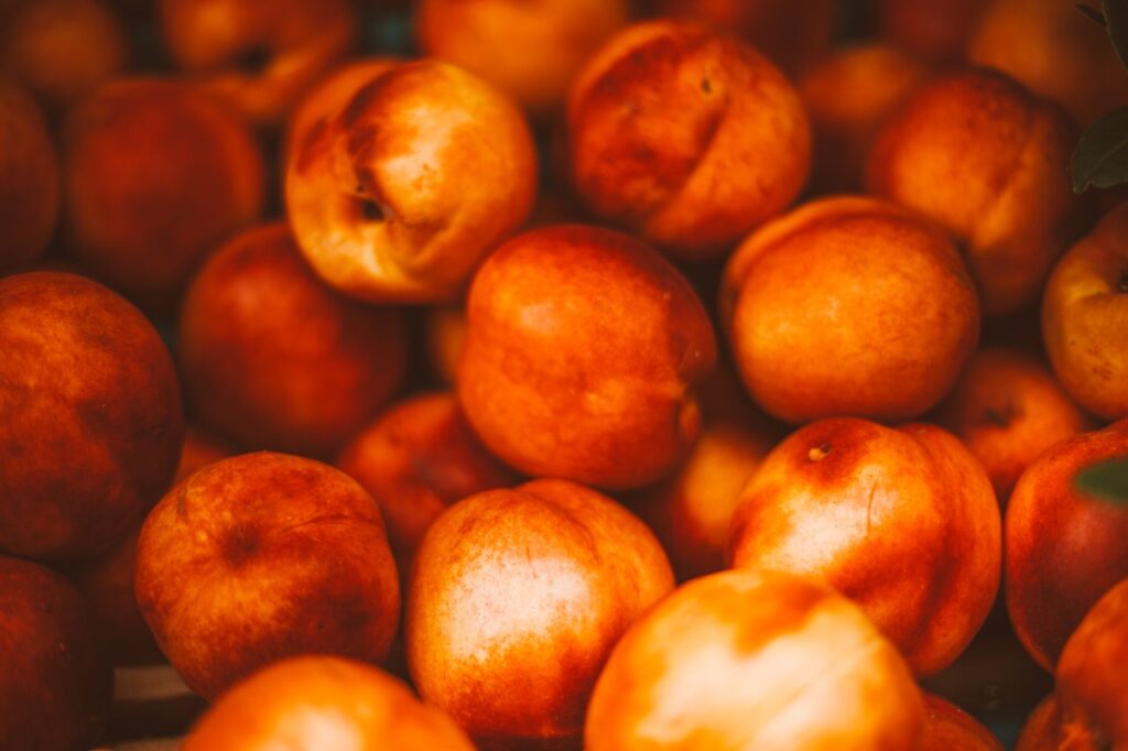 Close-up photo of fresh ripe peaches showcasing vibrant colors and healthy appeal.